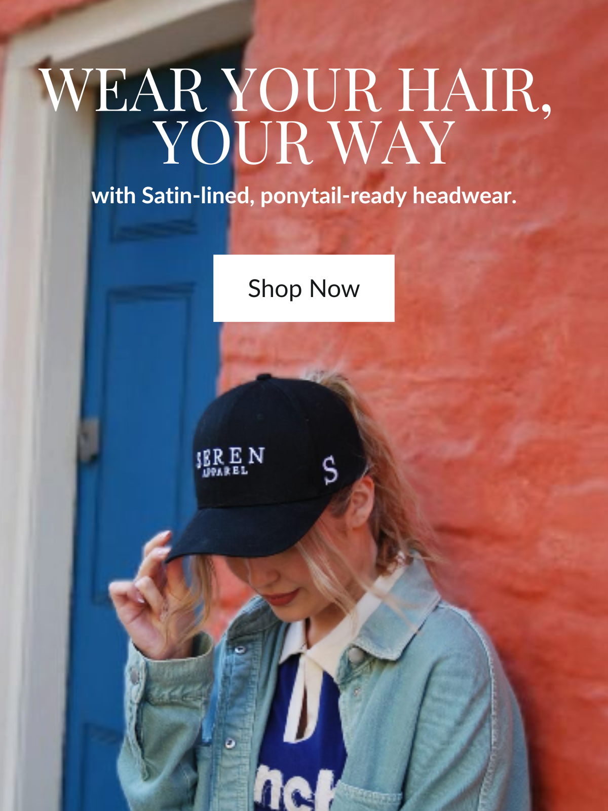 Person wearing a black ponytail baseball cap with 'Seren' branding against a colorful wall.